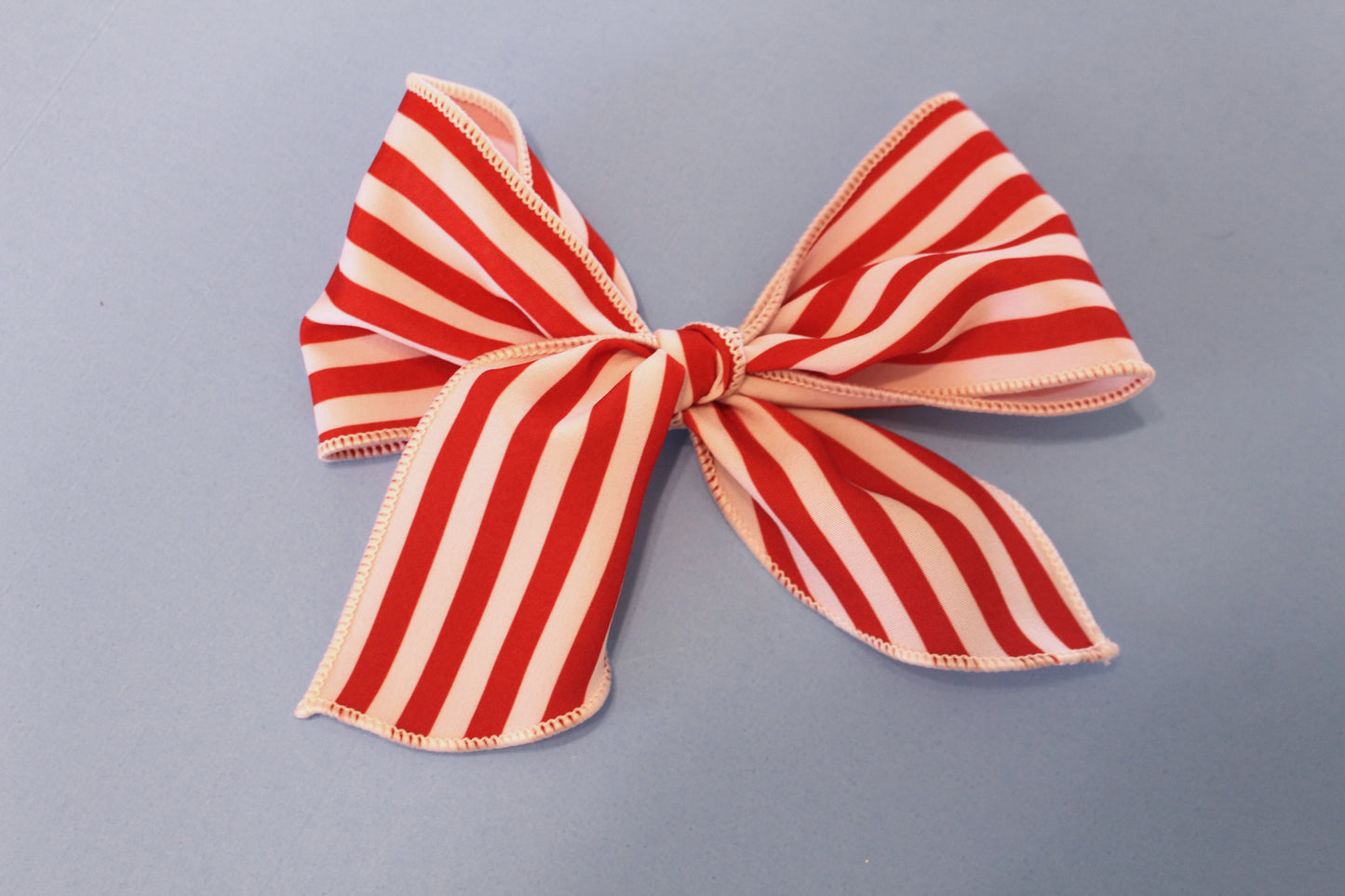 Large red stripe bow