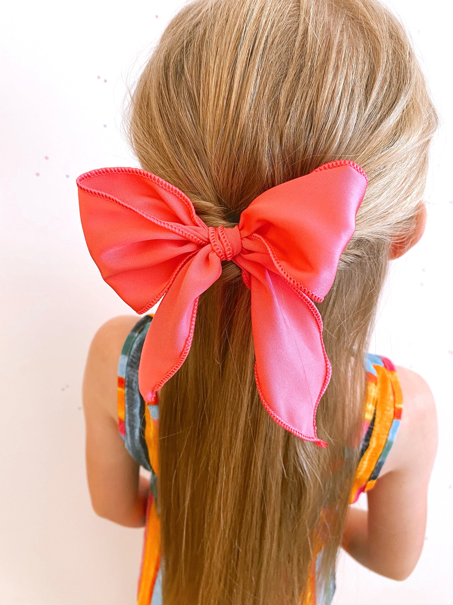 Large bright pink silk bow