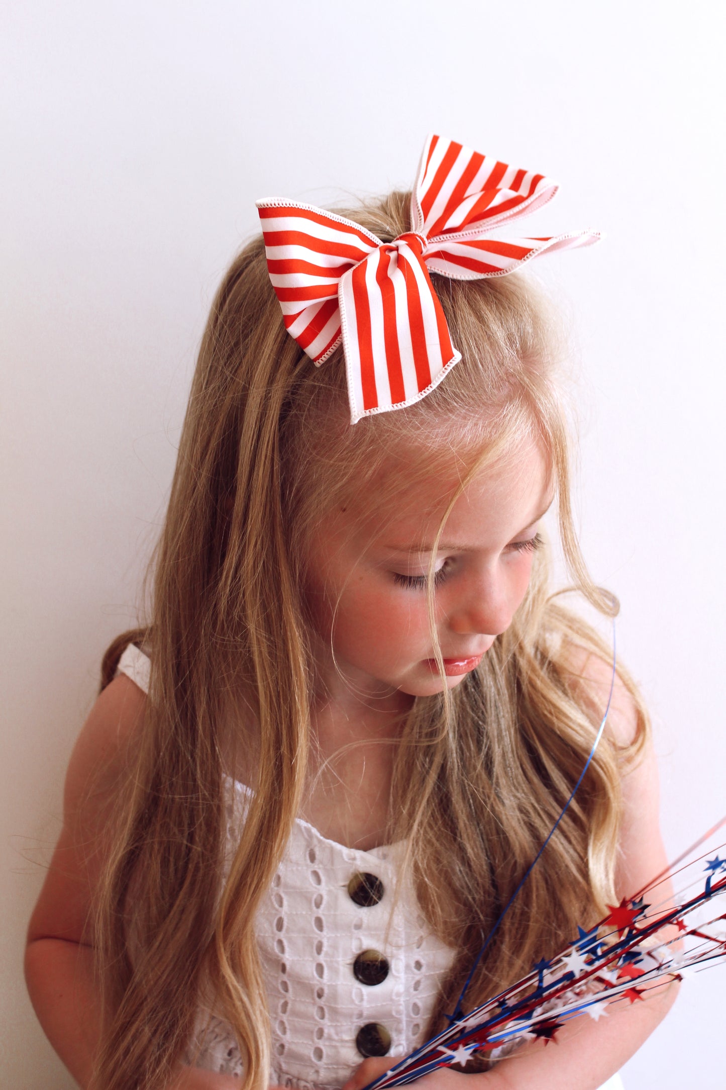 Large red stripe bow